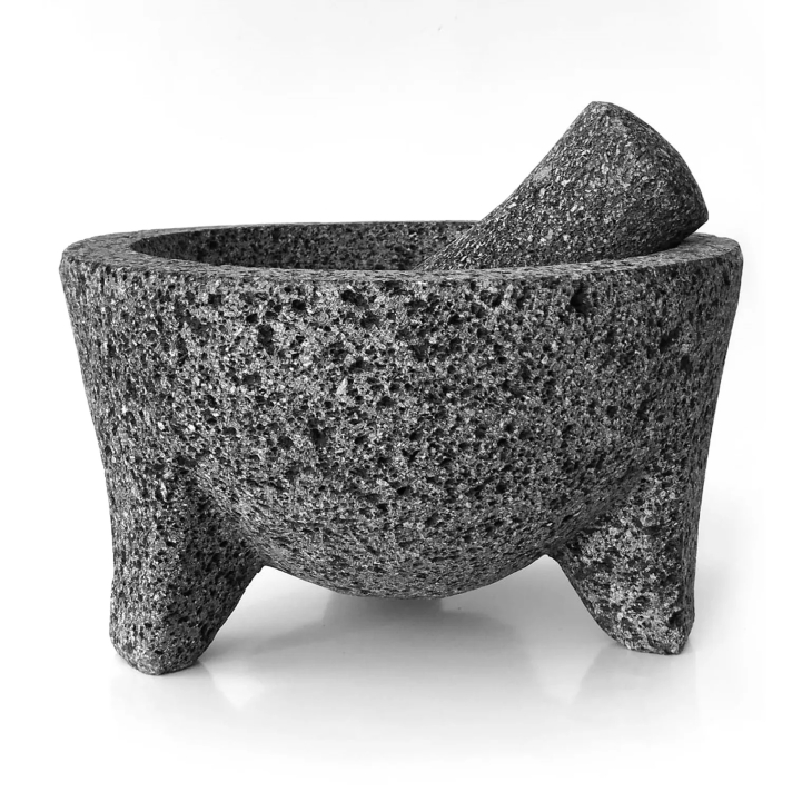 Mexican volcanic rock molcajete with pestle.