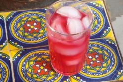 Blueberry limeade with ice and fresh lime.