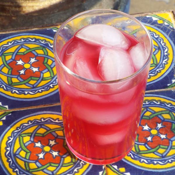 Blueberry limeade with ice and fresh lime.